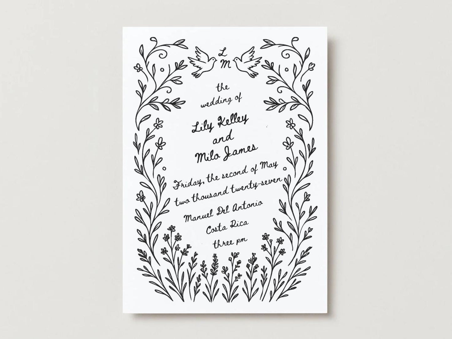 Gorgeous hand drawn wedding invitation with swirling wildflowers, doves, and custom initials.